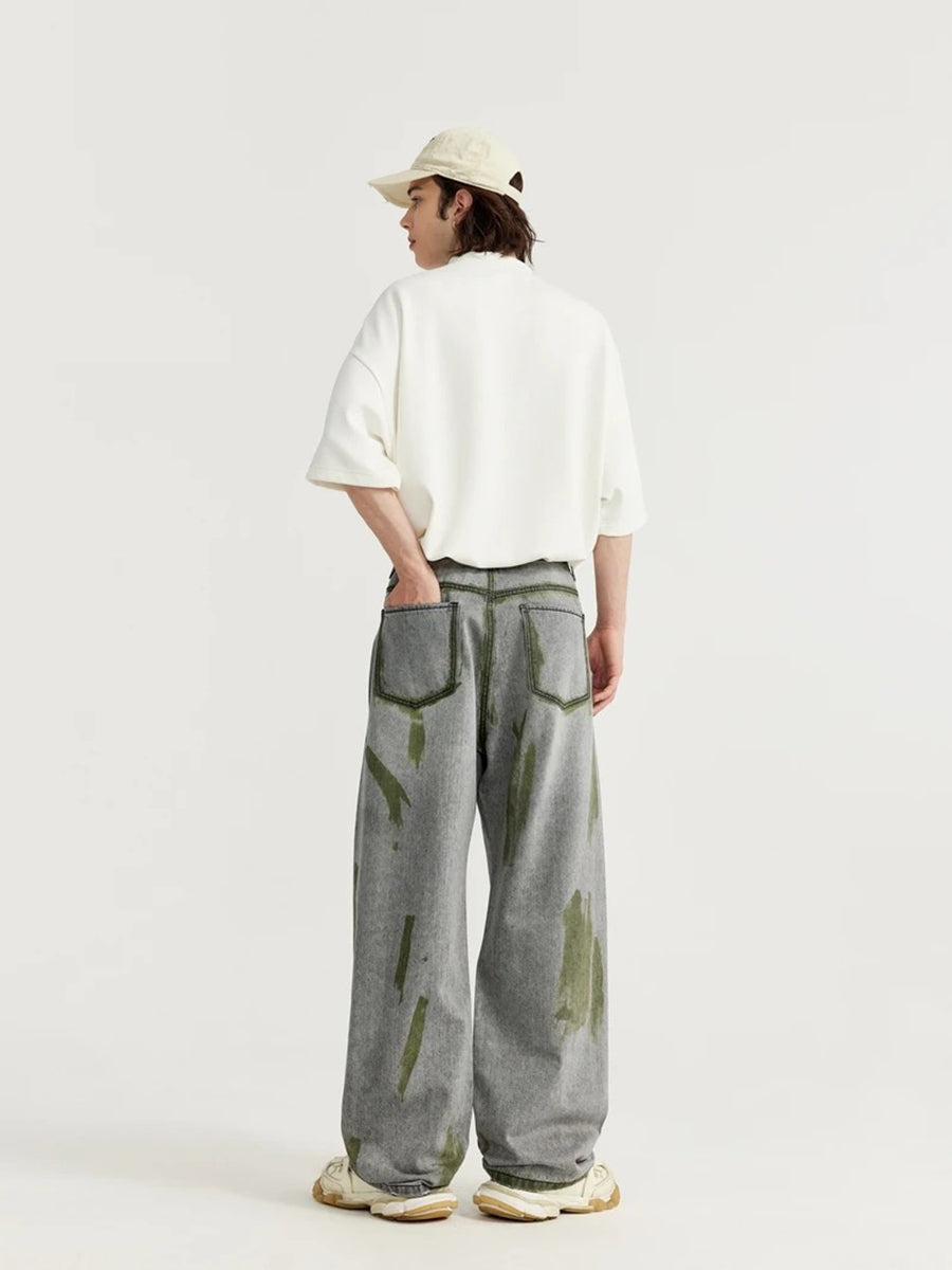 Grey Jeans With Green Paint Splatter